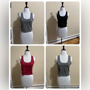 Four racerback crop tank tops. New never worn.